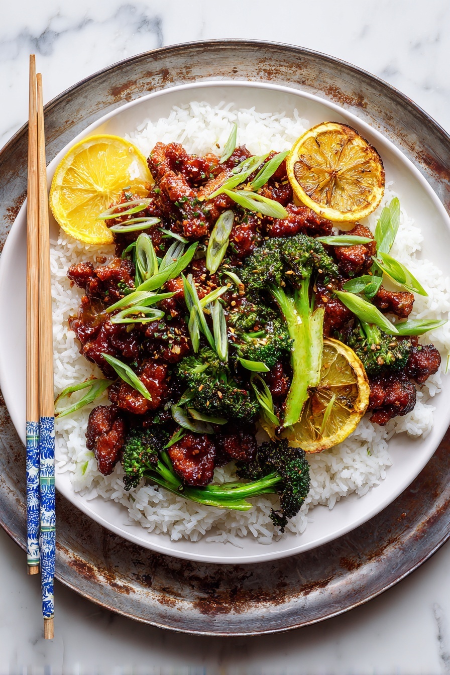 The image shows a bowl with a base layer of white rice topped with pieces of dark golden brown glazed chicken and bright green broccoli florets, accented by thin strips of fresh green onion scattered on top. The chicken pieces are caramelized with a sticky, textured sauce and sprinkled lightly with white sesame seeds. The bowl sits on a rustic metal tray, with a pair of wooden chopsticks, mostly natural wood color with blue and white patterned ends, placed to the left side of the bowl. The background features a white marbled texture and parts of other dishes and orange slices are slightly visible at the edges. photo taken with an iphone --ar 2:3 --v 7