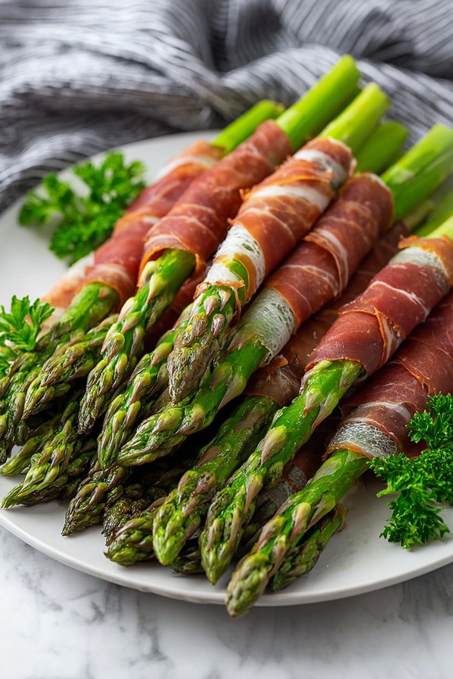 On a white plate, many green asparagus stalks are wrapped in thin, reddish-brown slices of cured meat, each stalk showing the textured, slightly charred tips. The asparagus is bright green and smooth with some rough edges. The cured meat is glossy and slightly wrinkled, tightly spiraled around the middle of each stalk. Small green parsley sprigs decorate the side of the plate. The whole setup sits on a white marbled surface with a gray and white striped cloth in the background. Photo taken with an iphone --ar 2:3 --v 7