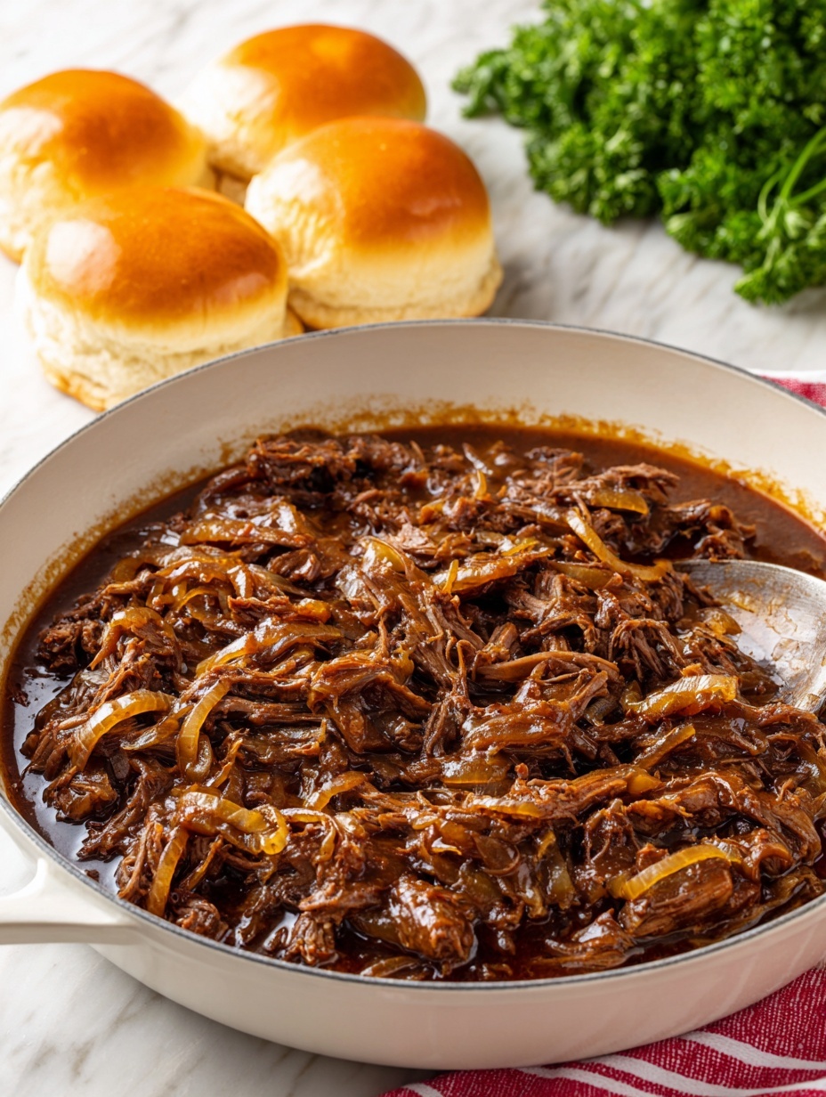 The image shows a large white pan filled with thin slices of brown cooked meat covered in a dark brown sauce with visible onions mixed in. The meat has a soft, tender look with some pieces curled up, and the sauce spreads unevenly along the edges of the pan. Next to the pan on the left side, there are three soft golden brown buns with a slightly shiny top, resting on a white and red striped cloth. In the background, some fresh green parsley leaves add a touch of color. The whole scene is set on a white marbled surface. photo taken with an iphone --ar 2:3 --v 7