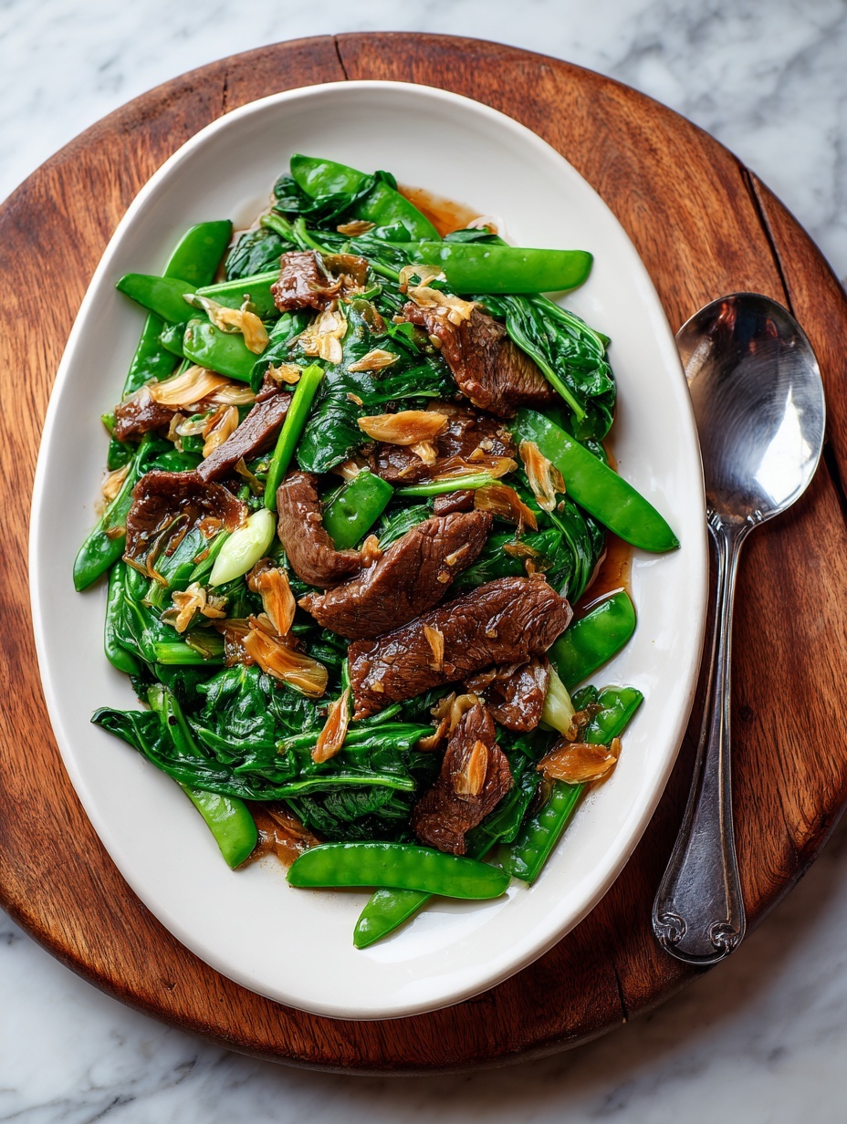 A dark blue bowl holds a bed of white steamed rice forming the bottom layer, with tender brown slices of meat coated in a shiny sauce piled on top. Thin red chili strips and light green rings of sliced pepper are scattered over the meat, adding bright color contrast. A pair of teal chopsticks rests on the right edge of the bowl. The bowl sits on a white marbled surface, with a blurred natural green background behind it. Photo taken with an iphone --ar 2:3 --v 7